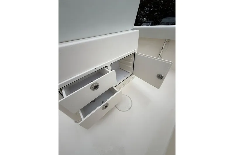 Slide: The Image of Storage compartments on a 2022 Cobia 220 Center Console boat. - 8