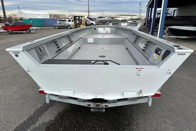 Slide: The Image of 2026 Smoker Craft Pro V Sportsman 2072 TL boat on trailer, displayed outdoors. - 5