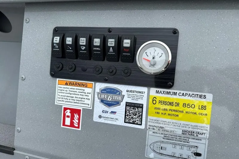 Slide: The Image of Control panel of 2026 Smoker Craft Pro V Sportsman 2072 TL boat with capacity and warning labels. - 7