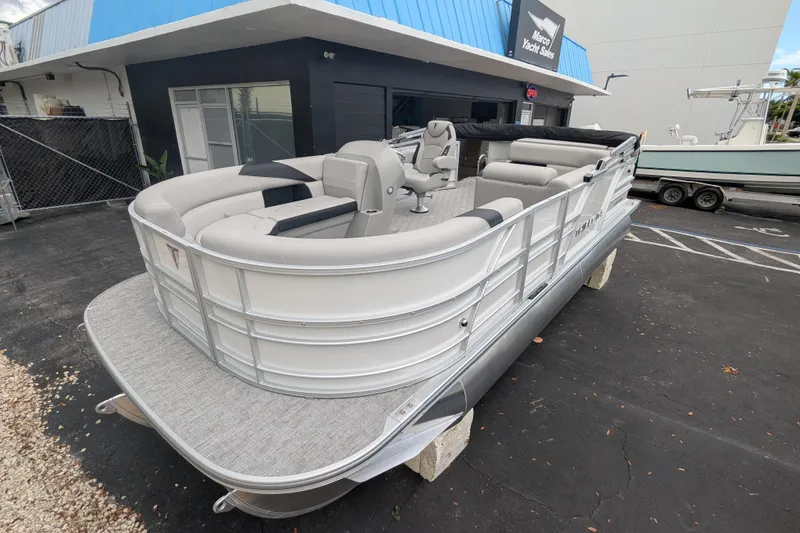 The Image of 2026 Trifecta 20CLE pontoon boat displayed at a yacht sales location. - 0