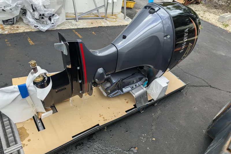 Slide: The Image of 2026 Trifecta 20CLE outboard motor on a pallet, ready for installation. - 3