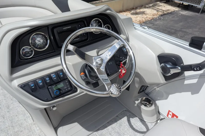 Slide: The Image of Steering console of 2026 Trifecta 20CLE boat with gauges and controls. - 6