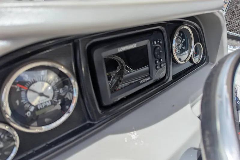 Slide: The Image of Dashboard of 2026 Trifecta 20CLE boat with gauges and Lowrance display. - 7