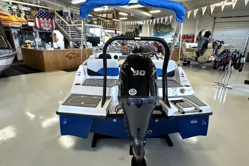 Slide: The Image of 2026 Starcraft SV 16 OB boat with 90 HP engine displayed in showroom. - 6