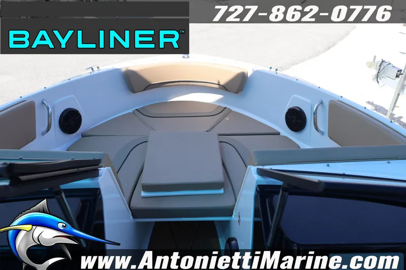 Slide: The Image of 2026 Bayliner V20 boat interior with cushioned seating, speakers, and marine branding. - 10