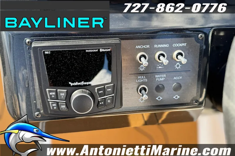 Slide: The Image of Control panel of 2026 Bayliner V20 boat with audio system and switches. - 18