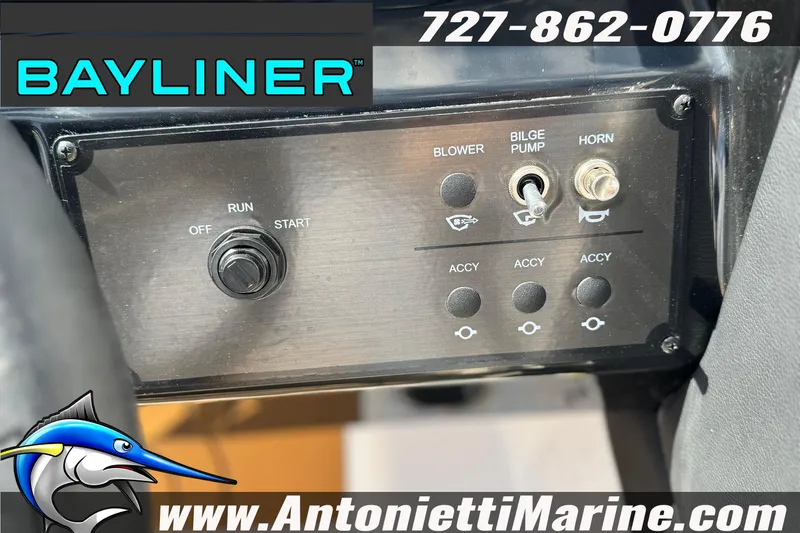 Slide: The Image of Control panel of 2026 Bayliner V20 boat with switches and logo. - 19