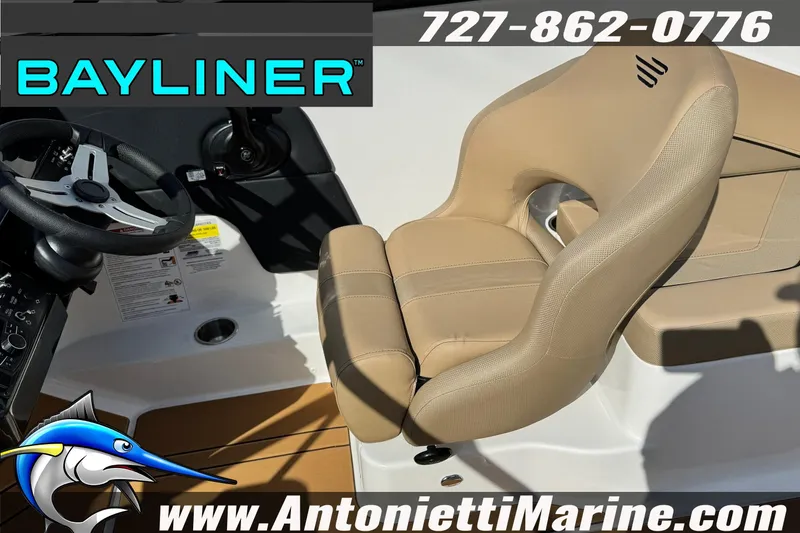 Slide: The Image of 2026 Bayliner V20 boat interior with beige seating and steering wheel, Antonietti Marine branding. - 23