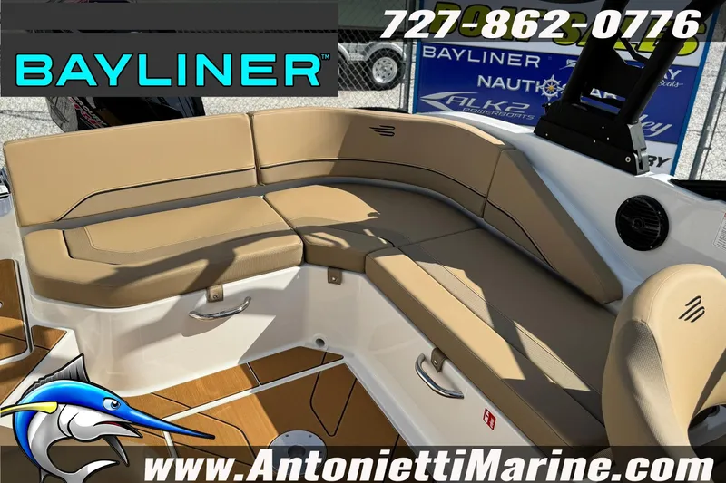 Slide: The Image of Interior seating of 2026 Bayliner V20 boat with tan cushions and modern design. - 24