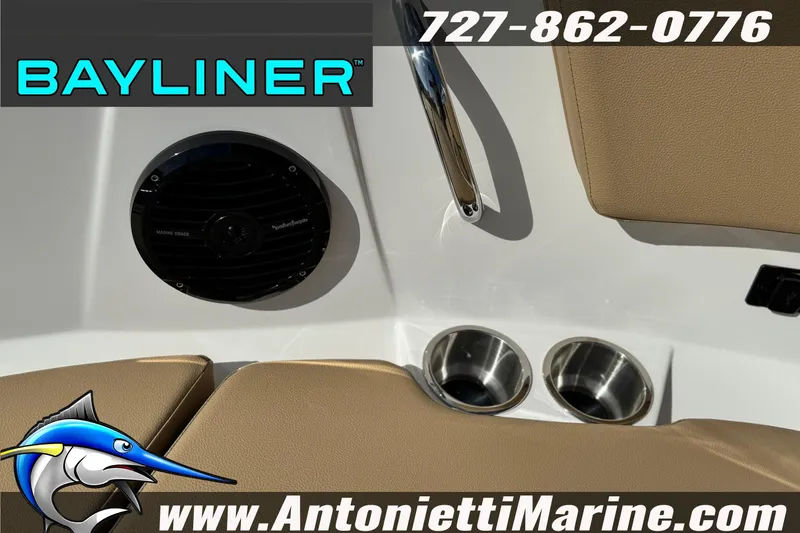 Slide: The Image of Bayliner V20 2026 boat interior with speaker, cup holders, and contact information. - 29