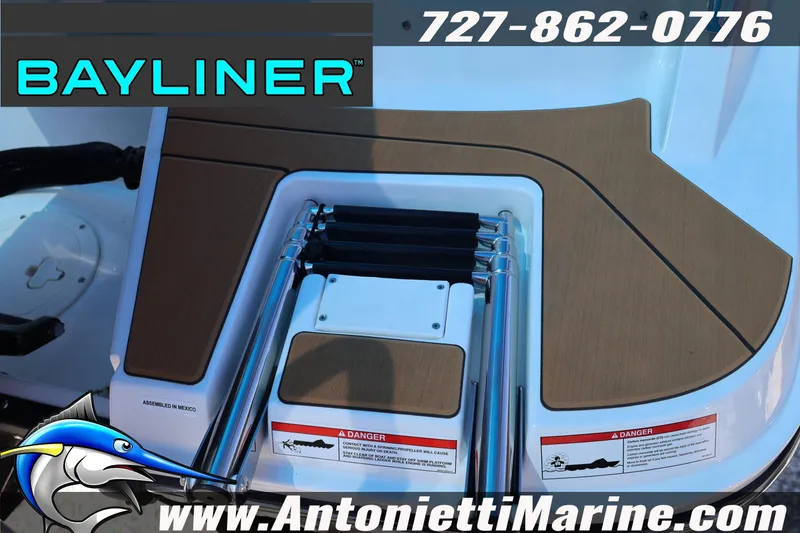Slide: The Image of Bayliner V20 2026 boat deck with ladder, contact info, and logo. - 4