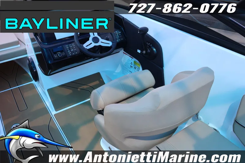 Slide: The Image of Interior view of 2026 Bayliner V20 boat cockpit with steering wheel and seating. - 5