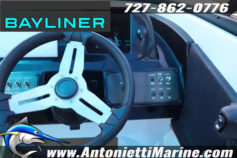 Slide: The Image of Steering wheel and control panel of 2026 Bayliner V20 boat, featuring modern design. - 7
