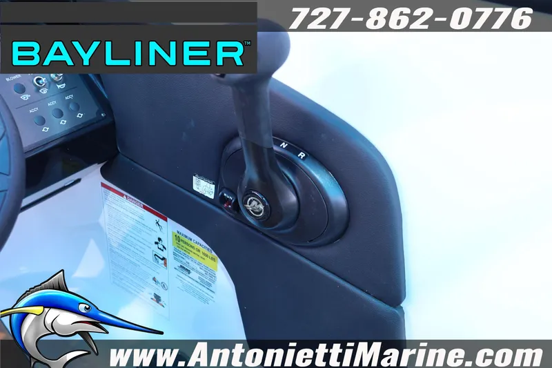 Slide: The Image of 2026 Bayliner V20 boat control panel with throttle lever and branding. - 8