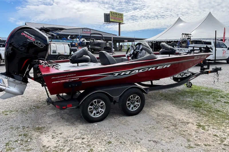 Slide: The Image of 2022 Tracker Pro Team 195 TXW Tournament Edition boat on trailer, outdoor display. - 3