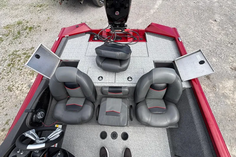 Slide: The Image of 2022 Tracker Pro Team 195 TXW Tournament Edition boat interior with gray seats and storage compartments. - 7