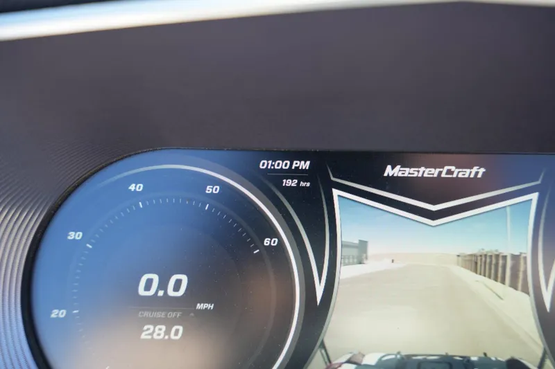 Slide: The Image of Dashboard of a 2019 MasterCraft X24 boat showing speedometer and rearview camera. - 12