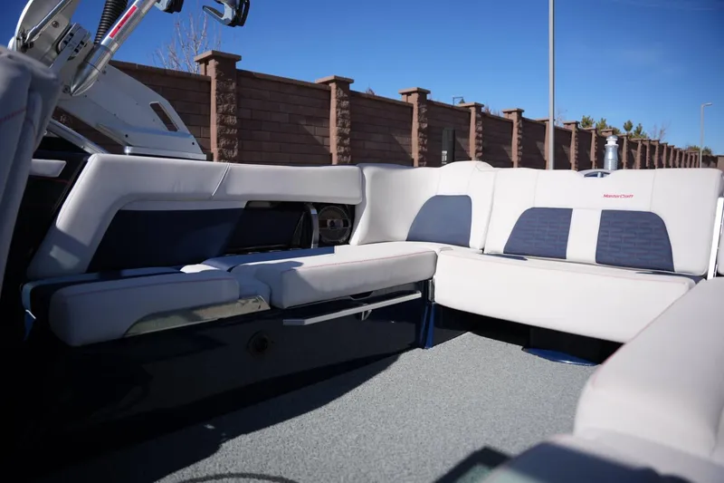 Slide: The Image of 2019 MasterCraft X24 boat interior with plush seating and modern design. - 16