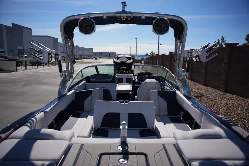 Slide: The Image of 2019 MasterCraft X24 boat interior with seating and wakeboard racks. - 20