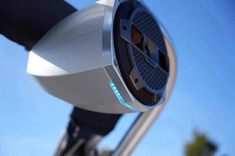 Slide: The Image of Close-up of a 2019 MasterCraft X24 boat speaker against a clear blue sky. - 24