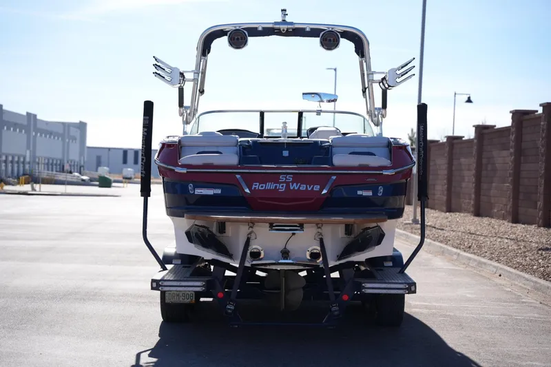 Slide: The Image of 2019 MasterCraft X24 boat on trailer, rear view, outdoors. - 3