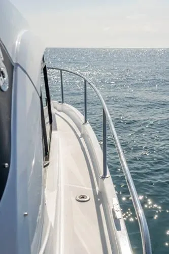 Slide: The Image of 2024 Beneteau Antares 8 V2 boat on open sea, side view. - 5