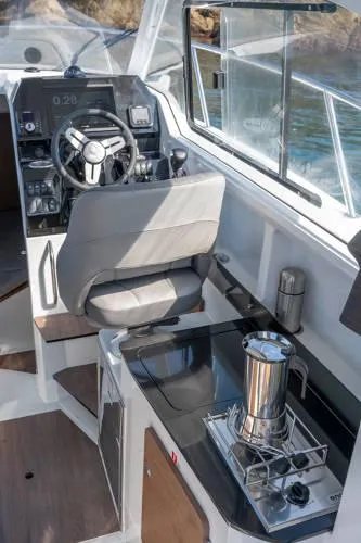 Slide: The Image of Interior of 2024 Beneteau Antares 8 V2 boat with helm and kitchenette. - 8
