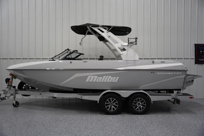 The Image of 2020 Malibu Wakesetter 21 VLX boat in showroom, side view. - 1