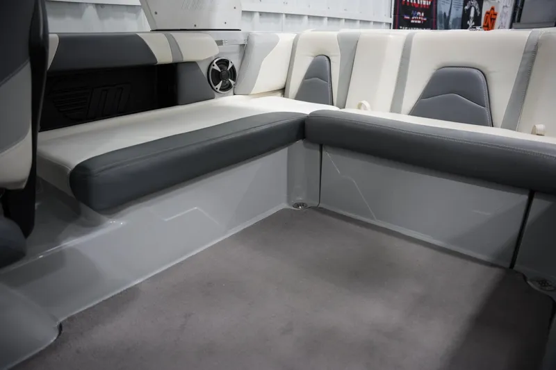 Slide: The Image of Interior seating of 2020 Malibu Wakesetter 21 VLX boat, featuring gray and white upholstery. - 10