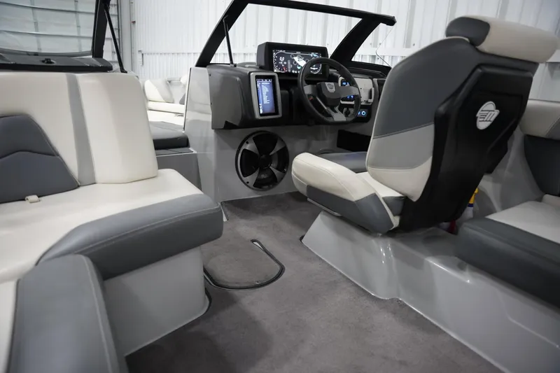 Slide: The Image of Interior of 2020 Malibu Wakesetter 21 VLX boat with modern dashboard and seating. - 11