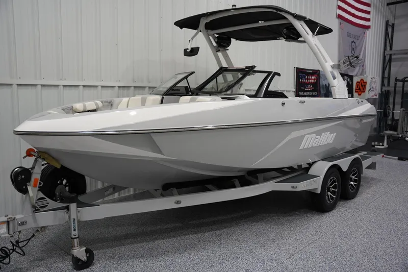 Slide: The Image of 2020 Malibu Wakesetter 21 VLX boat on trailer in indoor showroom. - 4