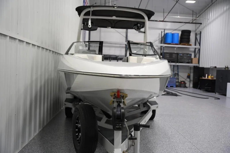 Slide: The Image of 2020 Malibu Wakesetter 21 VLX boat in a garage, front view. - 5