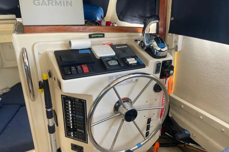 Slide: The Image of Steering console of 2007 Rosborough RF-246 Sedan Cruiser with Garmin navigation system. - 23