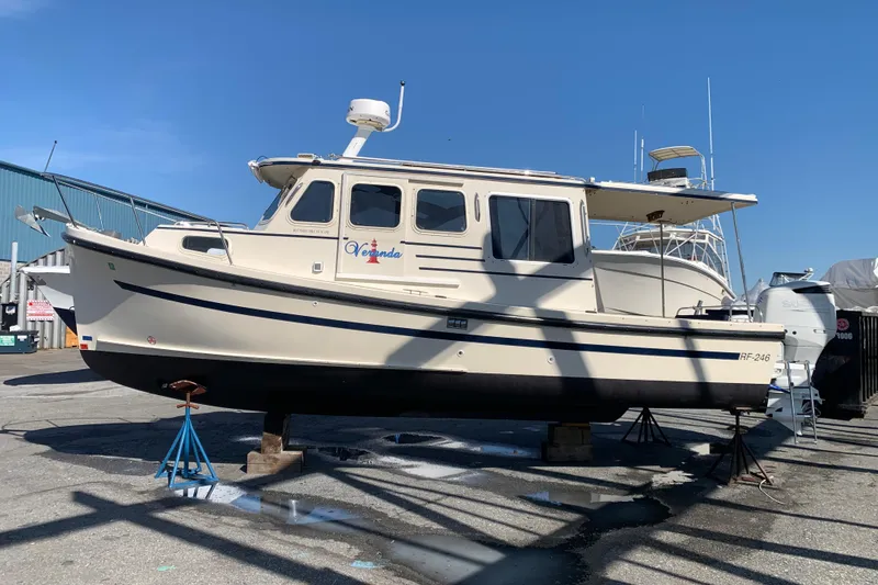 Slide: The Image of 2007 Rosborough RF-246 Sedan Cruiser on dry dock under clear blue sky. - 3