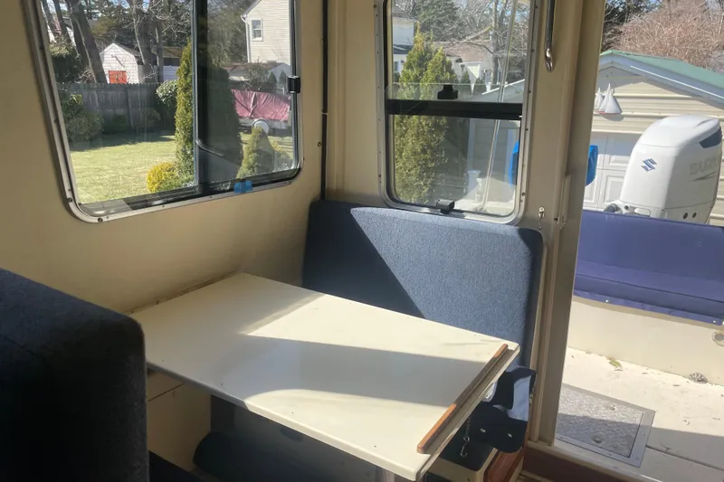 Slide: The Image of Interior of 2007 Rosborough RF-246 Sedan Cruiser with seating and table, sunlight streaming in. - 31