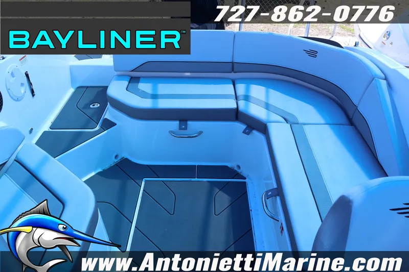 Slide: The Image of 2026 Bayliner V20 boat interior with seating, featuring marine-themed branding and contact information. - 13