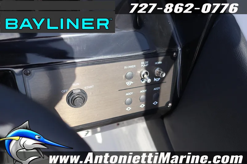 Slide: The Image of Control panel of 2026 Bayliner V20 boat with switches and logo. - 18