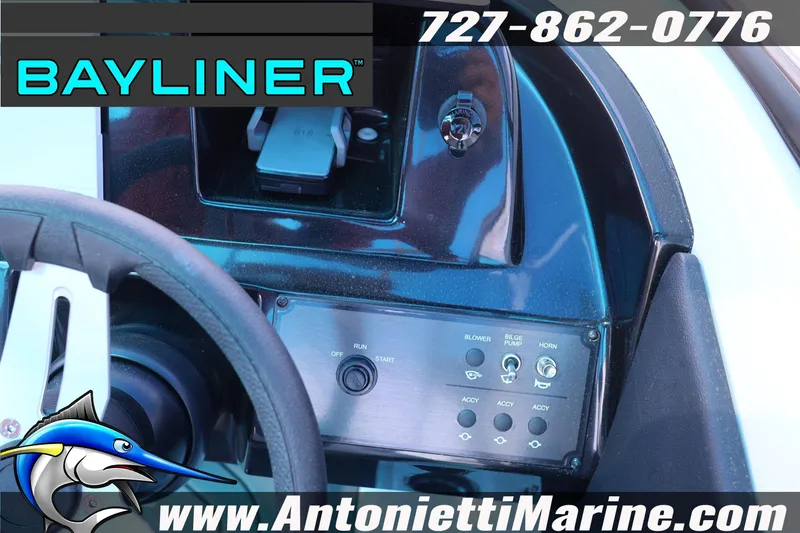 Slide: The Image of Dashboard of a 2026 Bayliner V20 boat with steering wheel and control panel. - 9