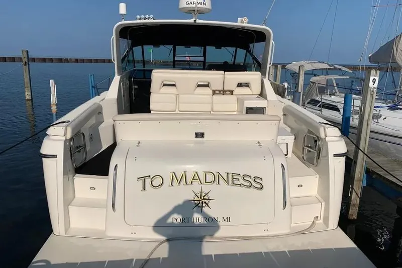 Slide: The Image of 1995 Tiara Yachts 4000 Express docked, named "To Madness," in Port Huron, MI. - 22