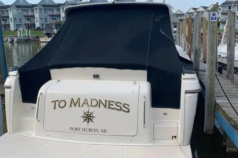 Slide: The Image of 1995 Tiara Yachts 4000 Express docked, named "To Madness," in Port Huron, MI. - 26
