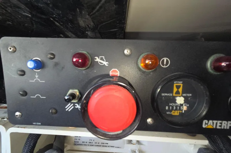 Slide: The Image of Control panel of a 2001 Tiara Yachts 5200 Express with Caterpillar service meter. - 17