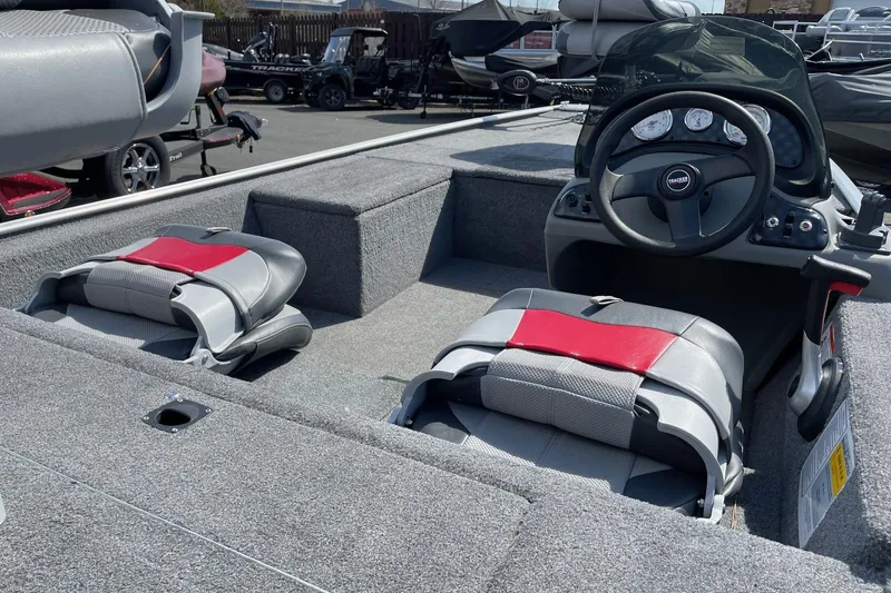 Slide: The Image of 2014 Tracker Pro 170 boat interior with steering wheel and seating. - 5