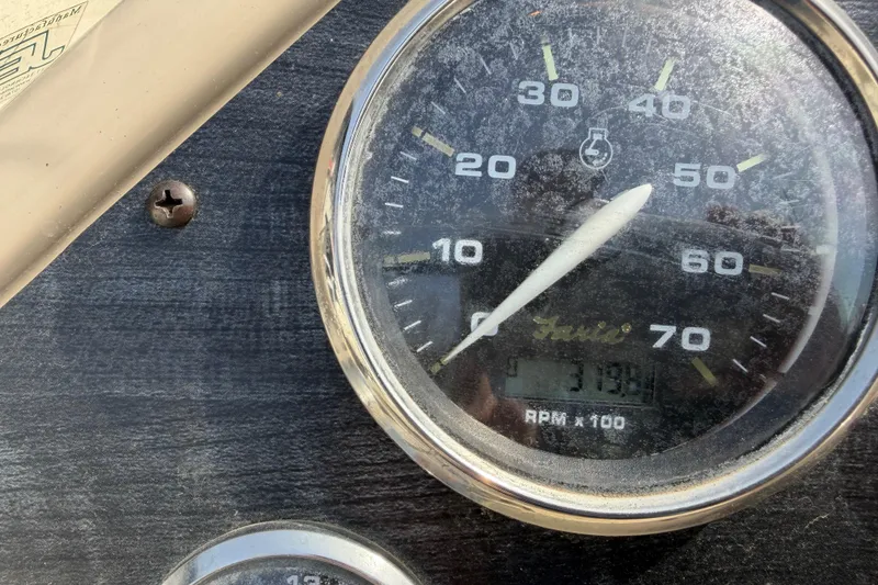 Slide: The Image of Close-up of a 2018 Godfrey Sweetwater 2486 SB boat tachometer showing RPM. - 19