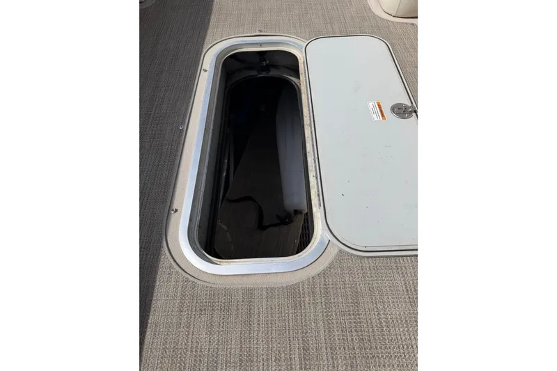 Slide: The Image of Open storage compartment on 2018 Godfrey Sweetwater 2486 SB boat deck. - 24