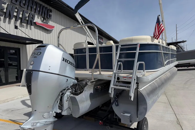 Slide: The Image of 2018 Godfrey Sweetwater 2486 SB pontoon boat with Honda 150 VTEC engine at a boating center. - 4