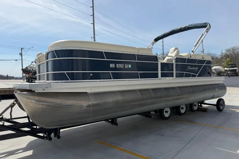 Slide: The Image of 2018 Godfrey Sweetwater 2486 SB pontoon boat on trailer in parking lot. - 8