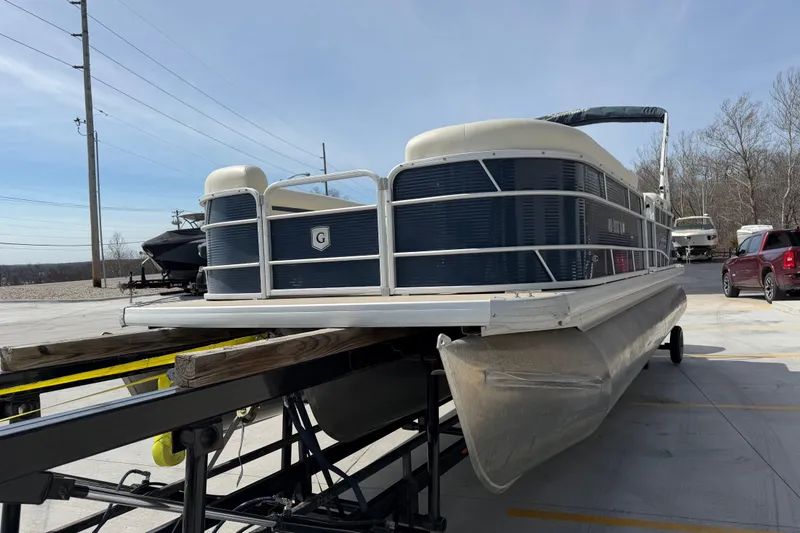 Slide: The Image of 2018 Godfrey Sweetwater 2486 SB pontoon boat on trailer in parking lot. - 9