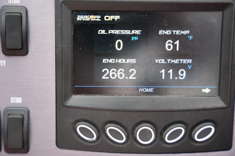 Slide: The Image of Dashboard display of a 2021 MasterCraft NXT24 showing engine metrics and controls. - 9