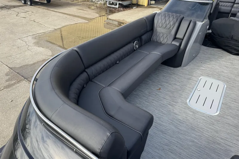 Slide: The Image of Luxurious seating on 2023 Bennington 30 QXFBAX2 pontoon boat, featuring sleek black upholstery. - 10
