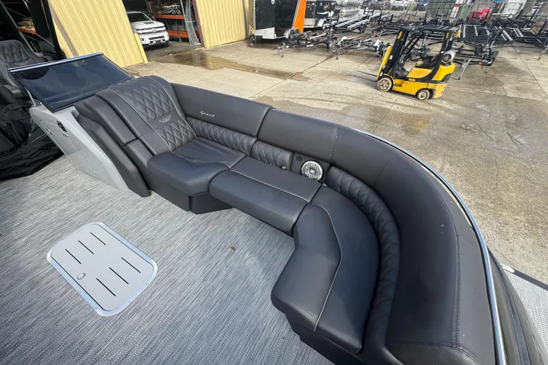 Slide: The Image of Luxurious seating on 2023 Bennington 30 QXFBAX2 boat, featuring sleek black upholstery. - 11